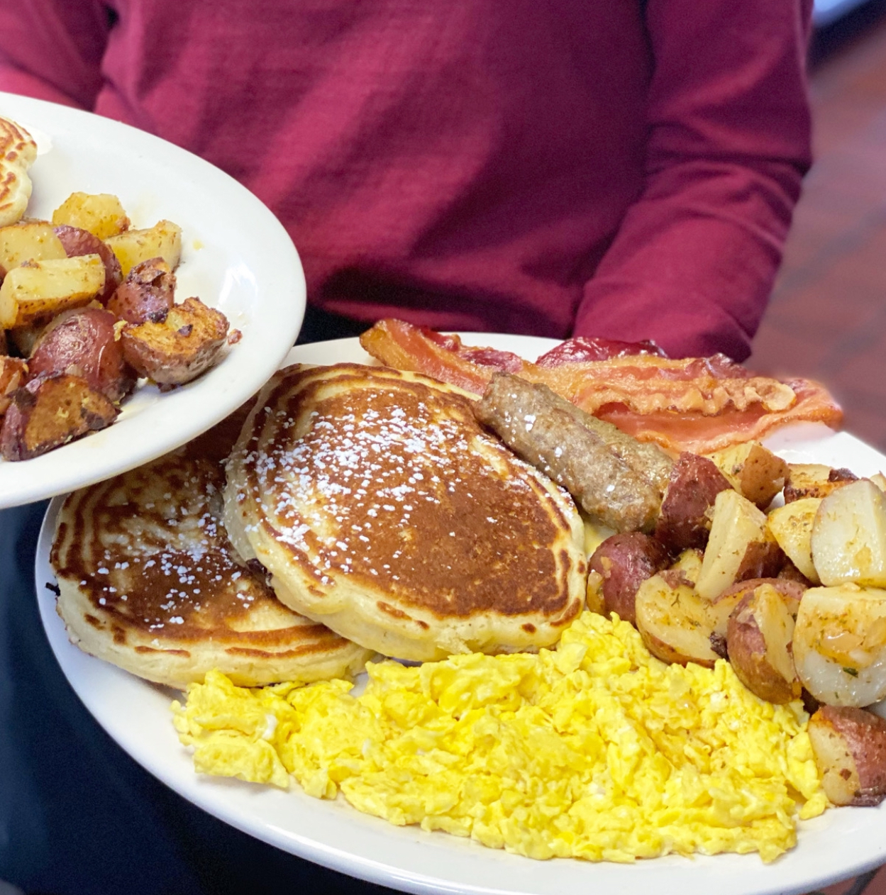 Broadway breakfast combo with pancakes, eggs, sausage and bacon